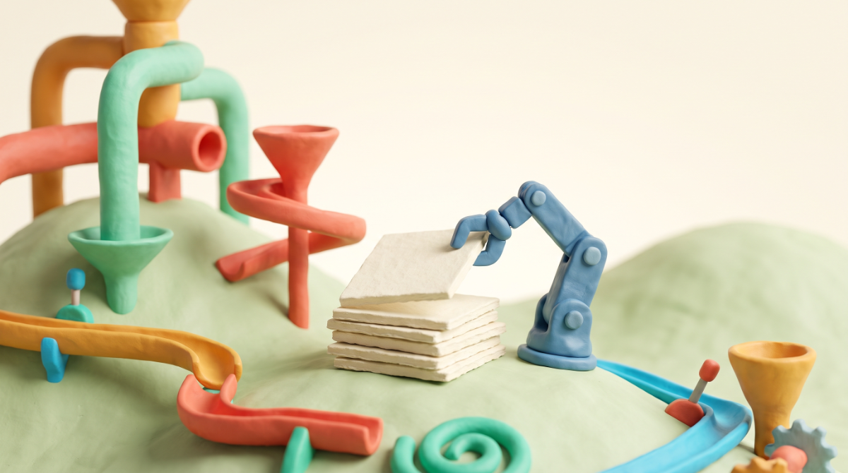 A clay contraption assembling a stack of pages