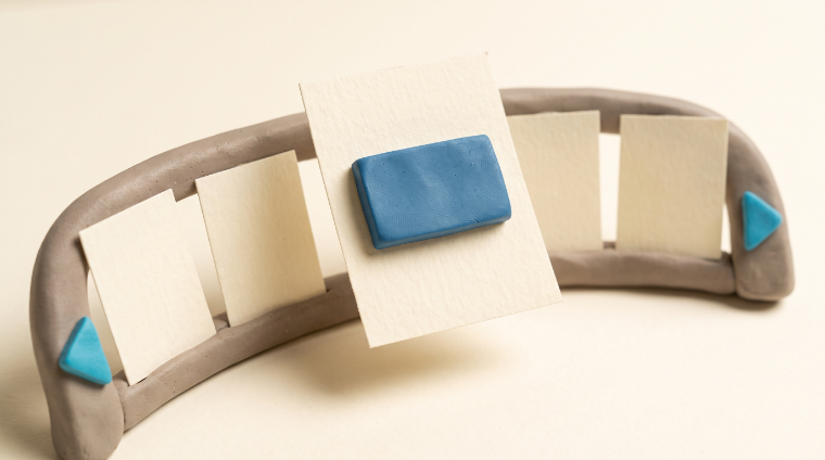 Paper panels on a curved clay rail